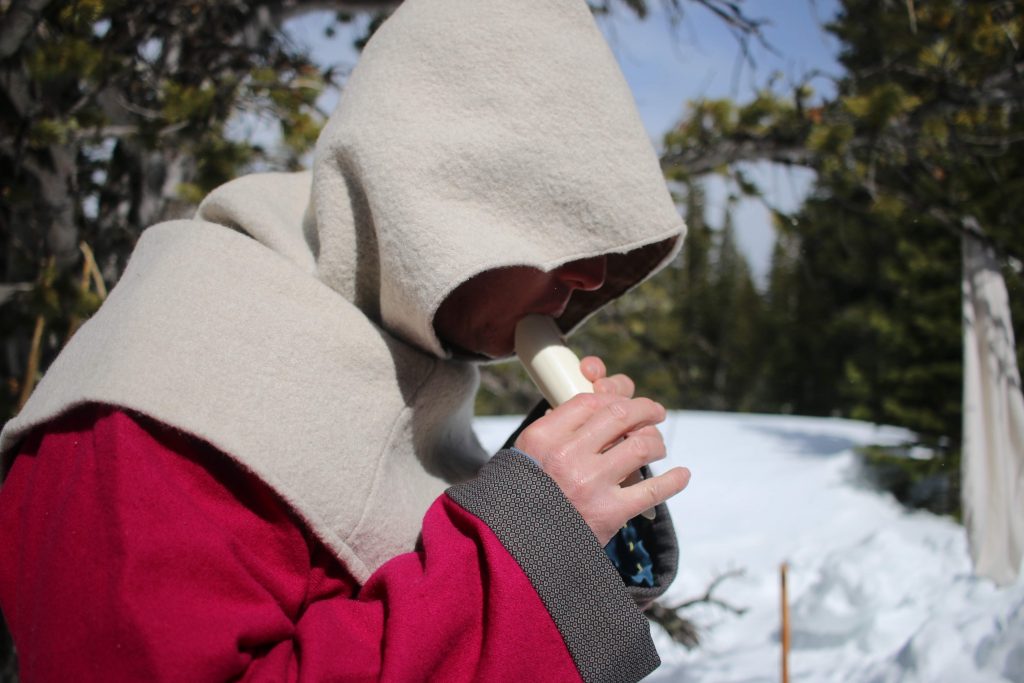 Playing a pipe, by Harrison Dreeves